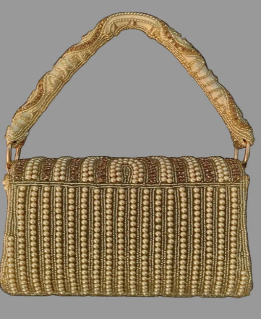 Gold pearl clutch bag