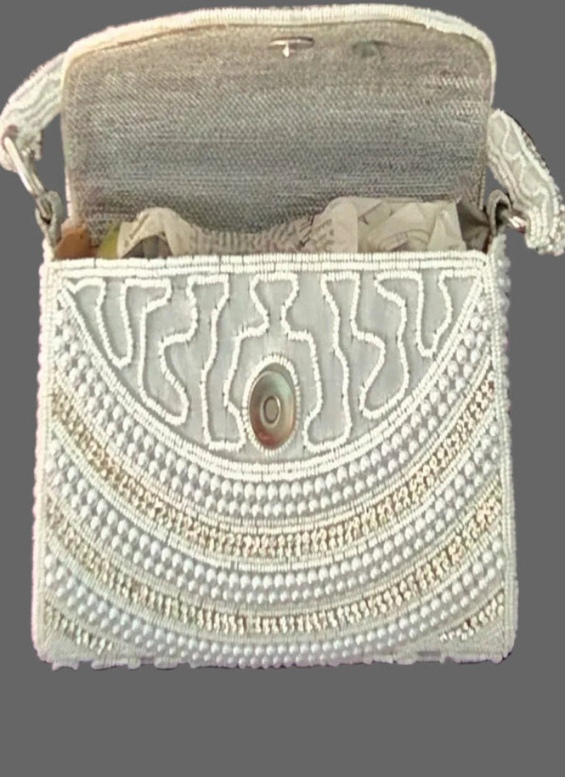 White pearl clutch bag