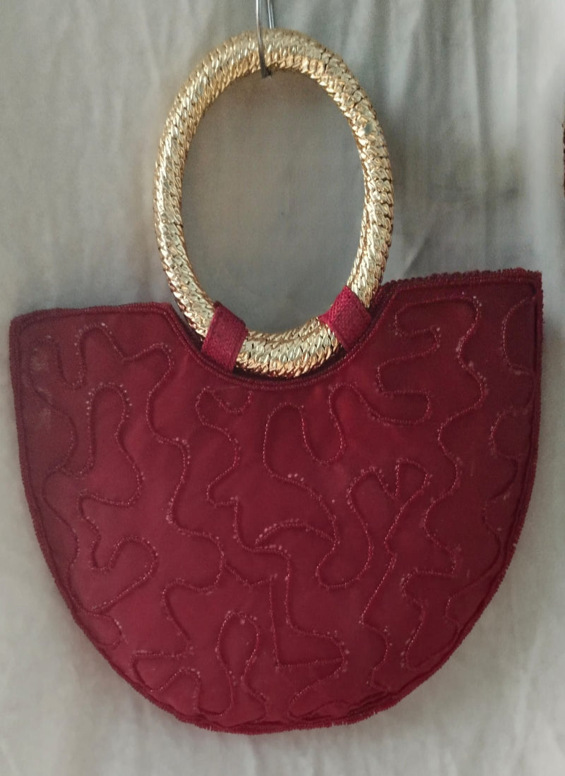 Red handbag with gold handle