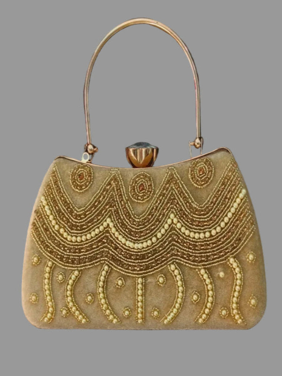 Gold beaded handbag with decorative patterns on a gray background