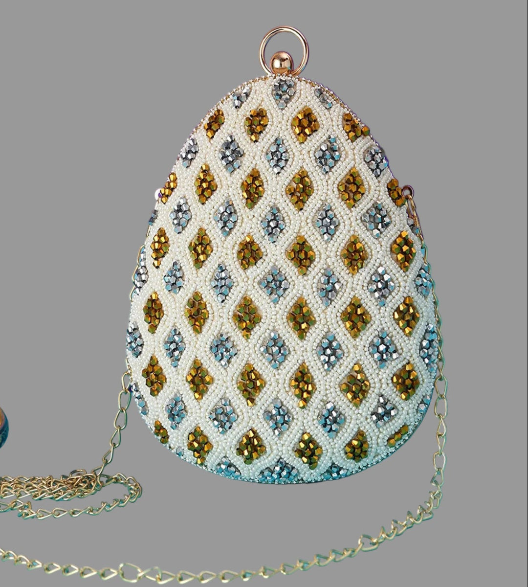 Decorative handbag with beadwork on a gray background