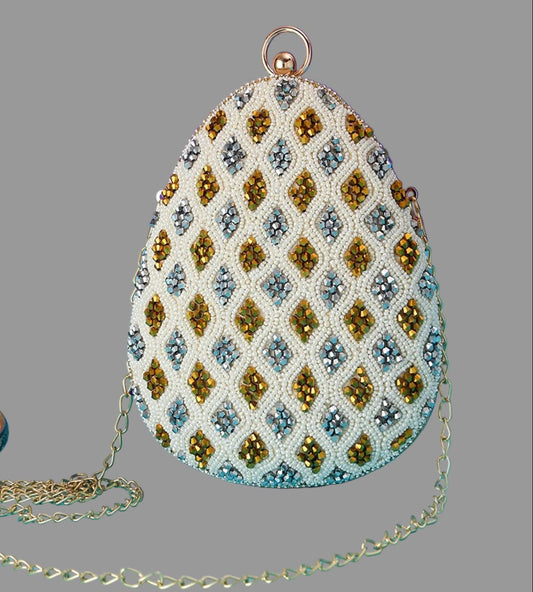 Decorative handbag with beadwork on a gray background
