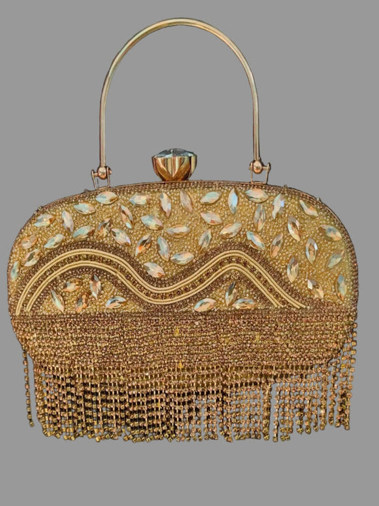 Gold beaded handbag with fringe on a gray background