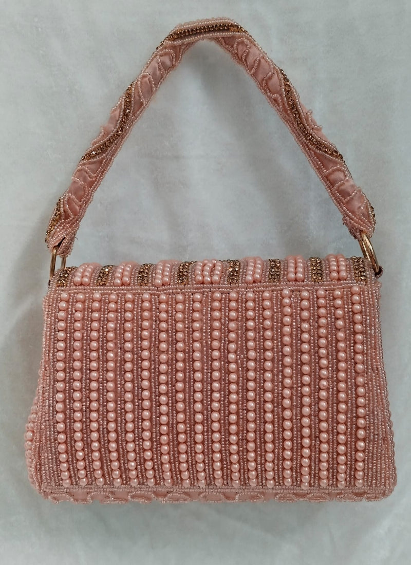 Peach pearl clutch bag