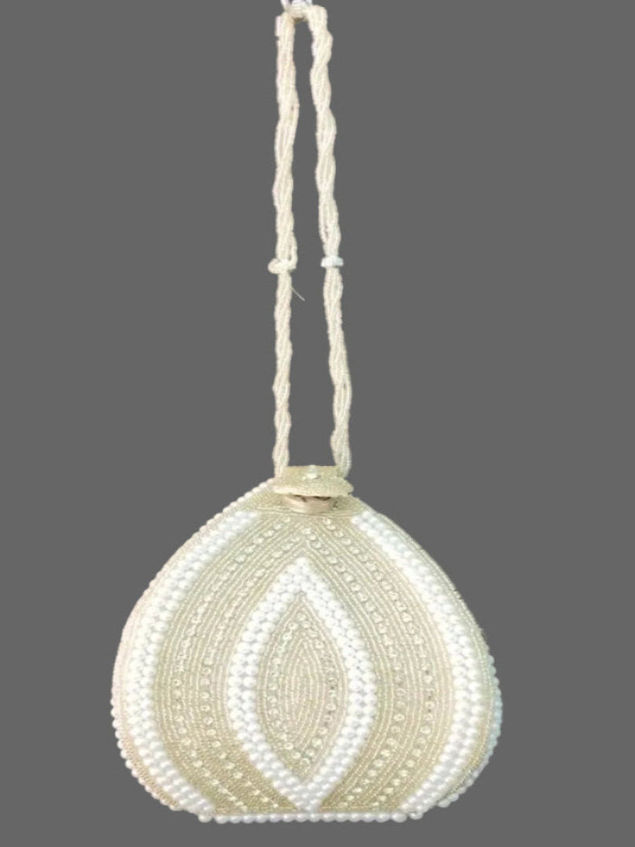 Beaded handbag with a string on a gray background