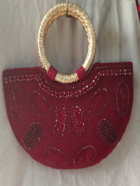 Red handbag with gold handle