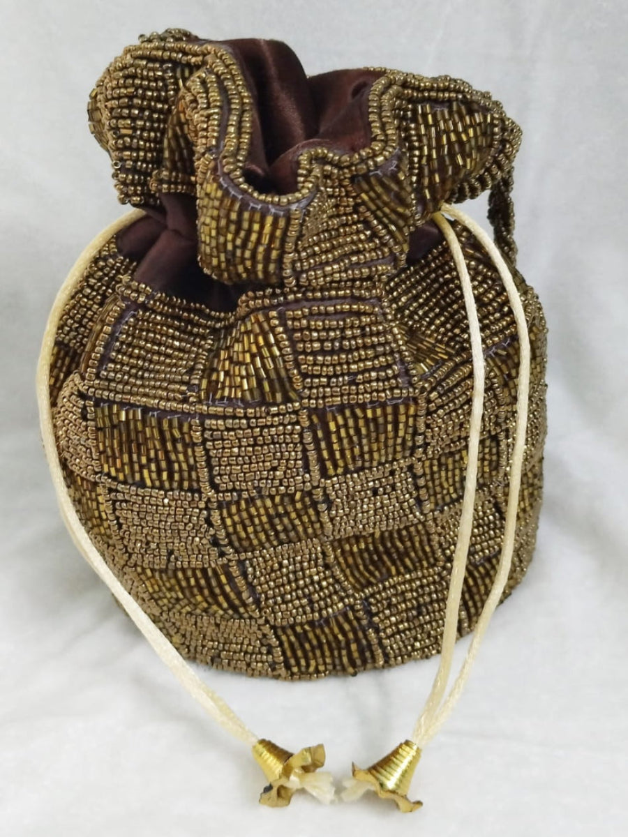 Decorative beaded bag with drawstring on a white background