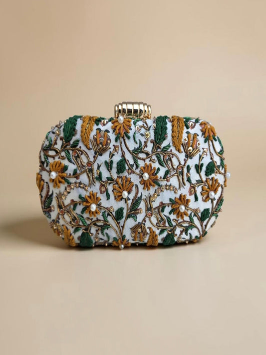 Decorative clutch bag with floral patterns on a beige background