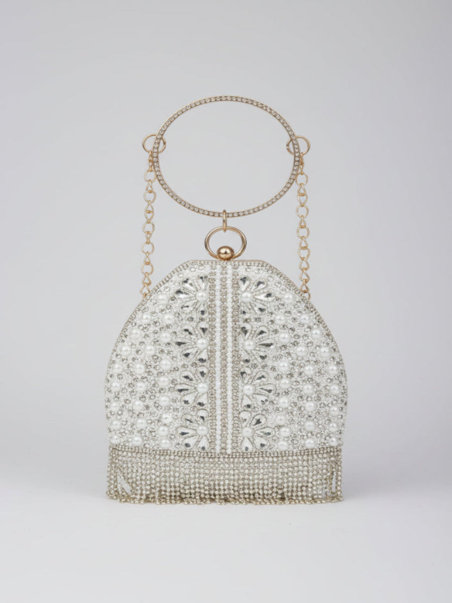 Elegant beaded handbag with a chain handle on a light gray background