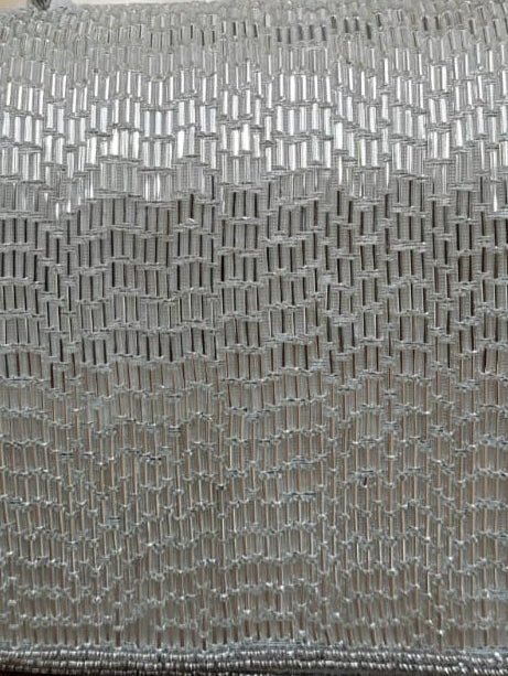 Close-up of a metallic woven pattern